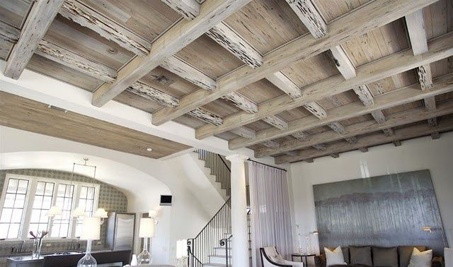 Pecky cypress beams in vaulted great room